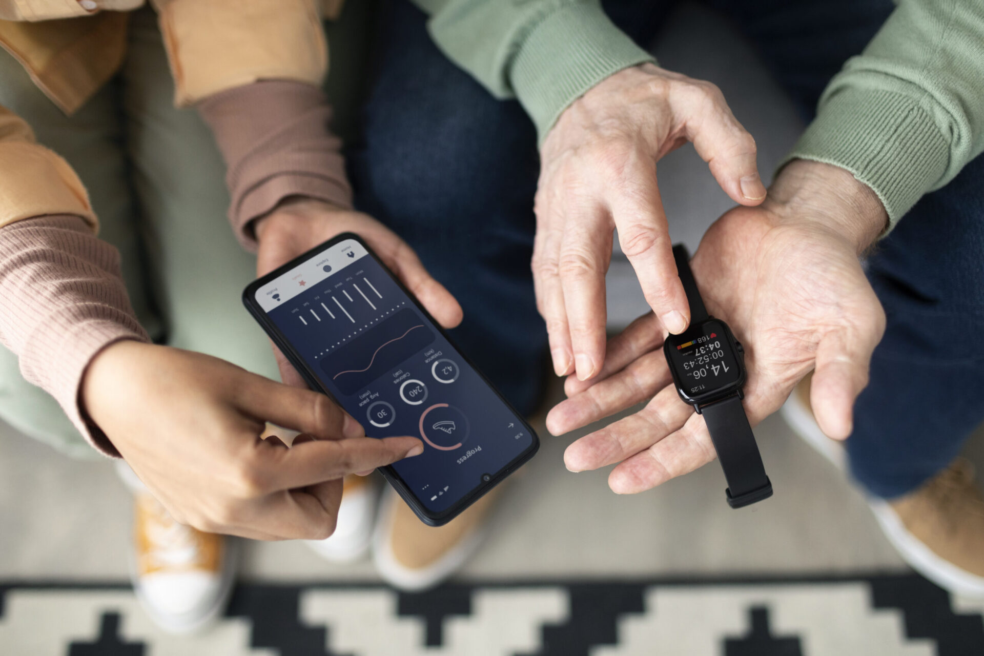 arabic-woman-teaching-senior-man-use-smartwatch-with-smartphone